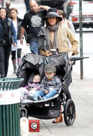 Vera Farmiga, Gytta Lubov Hawkey and Fynn Hawkey Vera Farmiga pushing her children in a stroller while out and about...