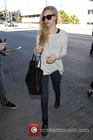 Amanda Seyfried - Celebrities arrive at LAX Airport Los Angeles California United States Monday 21st January 2013