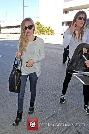 Amanda Seyfried and Jennifer Carpenter - Celebrities arrive at LAX Airport Los Angeles California United States Monday 21st January 2013