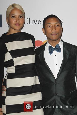 Helen Lasichanh and Pharrell Williams - Clive Davis & The Recording Academy's 2013 Pre-Grammy Gala Los Angeles California United States...