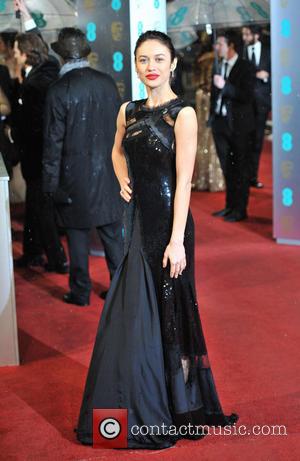 Olga Kurylenko - EE BAFTA arrivals London United Kingdom Sunday 10th February 2013