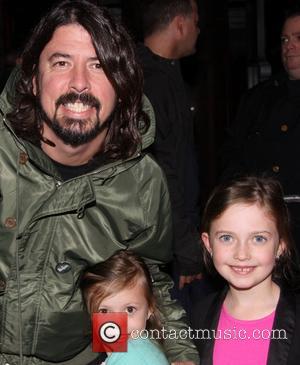 Dave Grohl, Harper Grohl and Violet Grohl - Dave Grohl takes his daughters to the Broadway musical 'Annie' at the...
