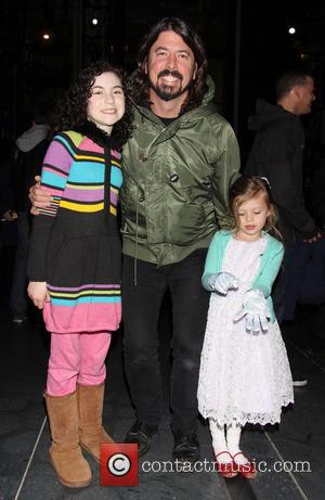 Lilla Crawford, Dave Grohl and Harper Grohl - Dave Grohl takes his daughters to the Broadway musical 'Annie' at the...
