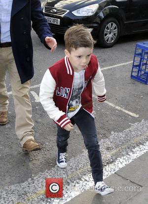 Cruz Beckham - The Beckham family arrive at a London entertainment venue at Heart Radio - London, United Kingdom -...