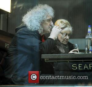 Brian May and Anita Dobson - Brian May,Anita Dobson take a having a drink at St. Pancras Station - London,...