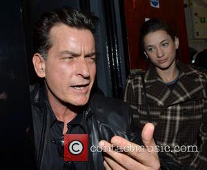 Charlie Sheen and Georgia Jones - Charlie Sheen poses for the cameras with his girlfriend, Georgia Jones before attending the...