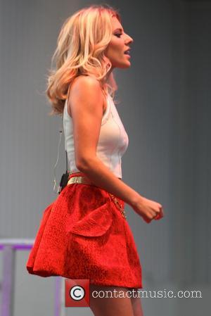 Mollie King - The Saturdays performing live on stage during the John Smith Grand National weekend at Aintree - Day...