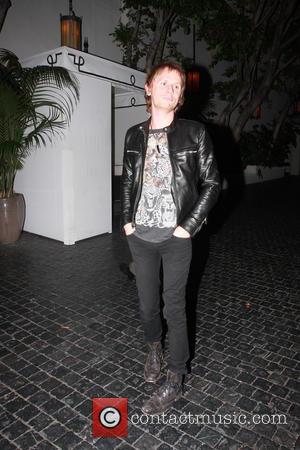 Muse - Muse drummer Dominic Howard is seen heading...