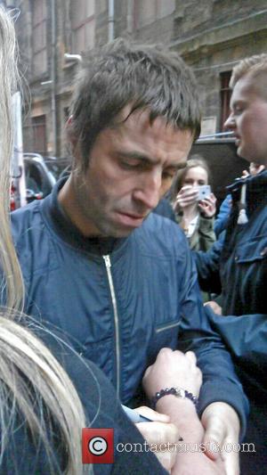 Liam Gallagher - Liam Gallagher seen outside the HMV Glasgow posing with fans after the Beady Eye in-store signing and...