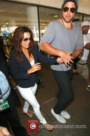 Eva Longoria and Ernesto Arguello - Eva Longoria with boyfriend Ernesto Arguello seen arriving at LAX Airport - Los Angeles,...