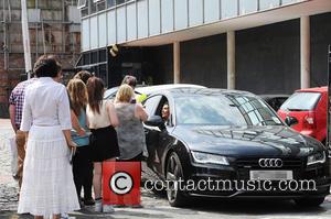 Kym Marsh and Kym Lomas - Kym Marsh stops and talks to waiting fans as she leaves the Coronation Street...