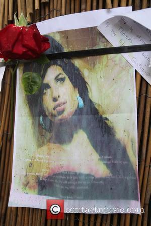 Fans lay tributes outside Amy Winehouse's home