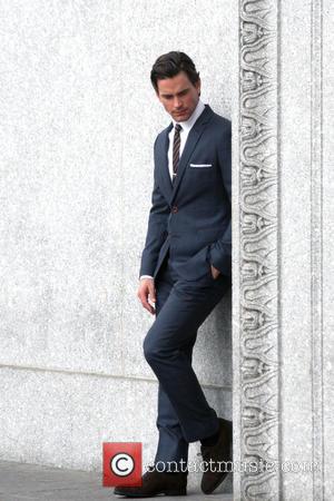 Matt Bomer - Matt Bomer looking sharp in a grey suit filming a scene for TV series 'White Collar' -...