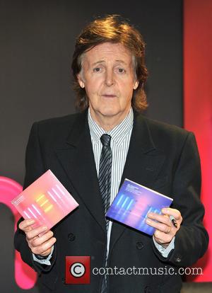 Paul McCartney - Paul McCartney signs copies of his new...