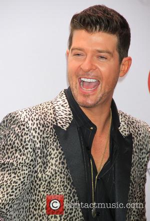  Robin Thicke Wants To Get "Back On Out On The Road" Following Split From Wife Paula Patton
