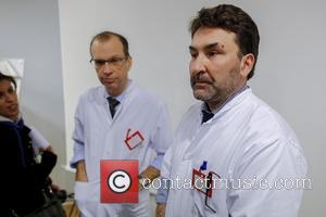 FRANCE, Grenoble : (From L)Professor Emmanuel Gay and  Neurosurgeon Professor Stephan Chabardes give a press conference about Michael Schumacher's...