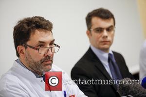 FRANCE, Grenoble : (From L) Neurosurgeon Professor Stephan Chabardes and Assistant Director Marc Penaud give a press conference about Michael...