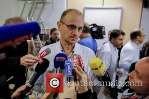 FRANCE, Grenoble : (From L) Professor Jean-Francois Payen give a press conference about Michael Schumacher's health condition on December 30,...