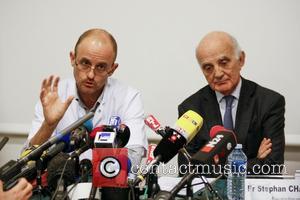 FRANCE, Grenoble : (From L) Professor Jean-Francois Payen and Professor and Michael Schumacher's friend Gerard Saillant give a press conference...