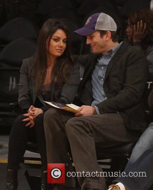 Mila Kunis - Celebs at the Lakers game.