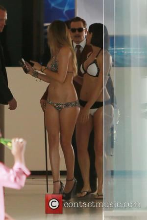 Johnny Depp - Johnny Depp filming on the set of 'Mortdecai' with scantily clad actresses wearing bikinis - Los Angeles,...
