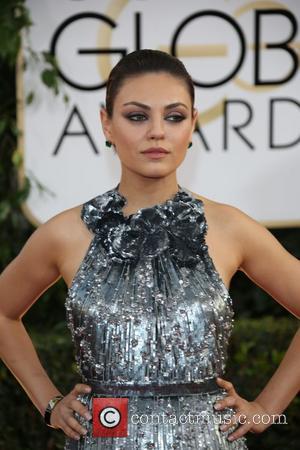 Mila Kunis - 71st Annual Golden Globes - Red Carpet...