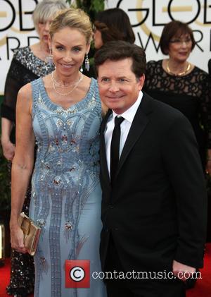 Michael J. Fox and Tracy Pollan - 71st Annual Golden Globes - Red Carpet Arrivals - Los Angeles, California, United...
