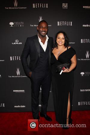 Idris Elba and Naiyana Garth - The 71st Annual Golden Globe Awards - Weinstein Party  at The Beverly Hilton...