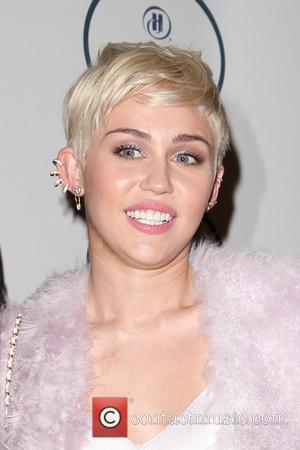 Miley Cyrus - 2014 Pre-Grammy Gala & Grammy Salute to...