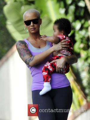Amber Rose - American rapper Wiz Khalifa takes his wife and son Sebastian on a hike to Runyon Canyon -...