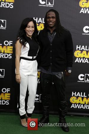 Jamaal Charles and Guest - Cartoon Network's Hall of Game Awards at The Barker Hangar - Arrivals - Los Angeles,...