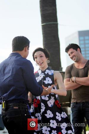 Mario Lopez, Meryl Davis and Maksim Chmerkovskiy - Dancing with the Stars celebrities appear on 'Extra' at Universal Studios -...