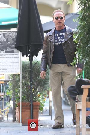 Arnold Schwarzenegger - Arnold Schwarzenegger and Ralf Moeller are  leaving Le Pain Quotidien cafe at the Brentwood with his...