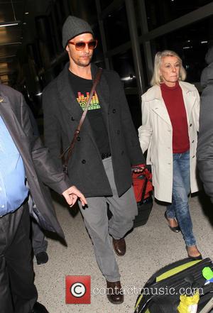 Matthew McConaughey - Matthew McConaughey arriving at LAX with his...