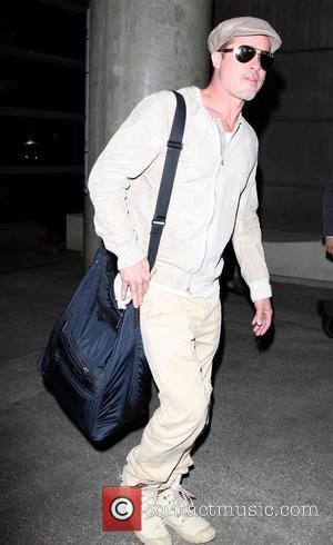 Brad Pitt - Brad Pitt arrives at LAX