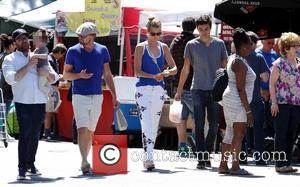 Leonardo DiCaprio and Toni Garrn - Leonardo DiCaprio and Toni Garrn shopping at the Beverly Hills Farmers Market. Leonardo DiCaprio...