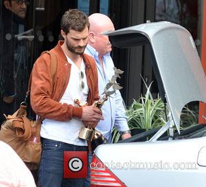 Jamie Dornan - Fifty Shades of Grey actor Jamie Dornan seen leaving The Doubletree Hilton Hotel Dublin carrying his IFTA...
