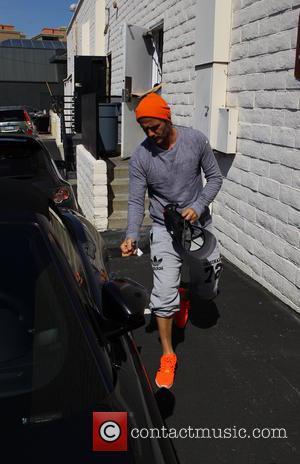 David Beckham - David Beckham seen leaving the gym in Beverly Hills wearing bright orange trainers and beanie hat -...