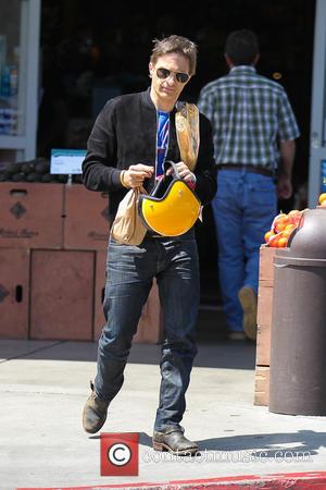 Olivier Martinez - Olivier Martinez picks up a French Baguette from Bristol Farms on his classic Harley Davidson motorcycle -...