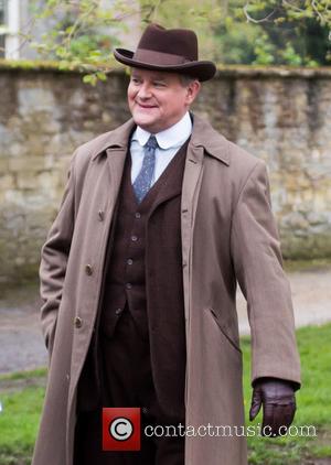 Hugh Bonneville - The cast of Downton Abbey film scenes on location outside a churchyard - Oxford, United Kingdom -...