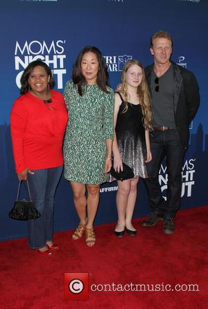 Chandra Wilson, Sandra Oh, Kevin McKidd and Iona McKidd - Premiere of 'Mom's Night Out' held at the TCL Chinese...