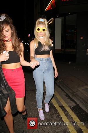 Pixie Lott - Pixie Lott flashes breast nipples in fishnet see-through top at Miley Cyrus party at Madam Jojo's -...