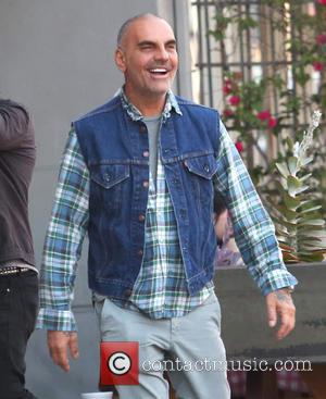 Christian Audigier - Christian Audigier and his girlfriend Nathalie Sorensen have lunch with Brazilian racing driver Tarso Marques at Bludso's...