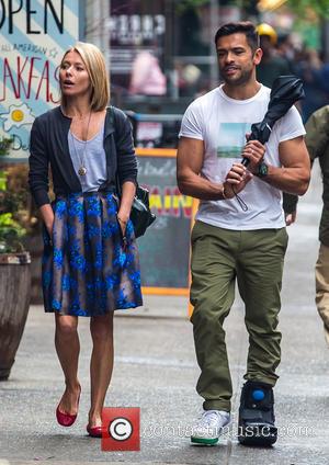 Kelly Ripa and Mark Consuelos - Kelly Ripa and Mark Consuelos were all smiles in spite of wet weather as...