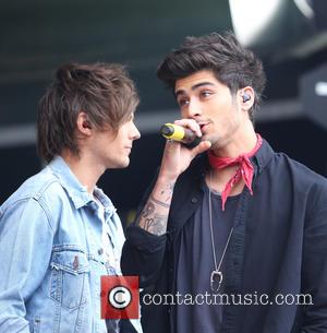 Louis Tomlinson and Zayn Malik - One Direction, 1 Direction, 1D perform on the Main Stage of the Radio 1...