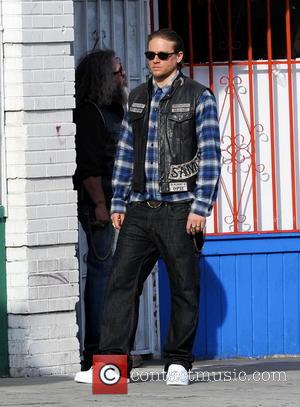 Charlie Hunnam - Charlie Hunnam hops on his bike on the set of 