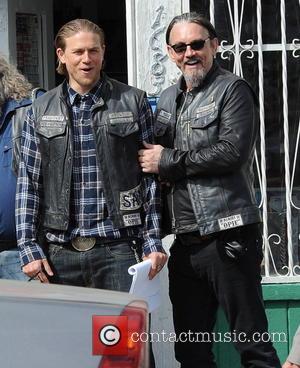 Charlie Hunnam and Tommy Flanagan - Charlie Hunnam hops on his bike on the set of 