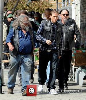 Charlie Hunnam, Tommy Flanagan, Kim Coates and Mark Boone Junior - Charlie Hunnam hops on his bike on the set...