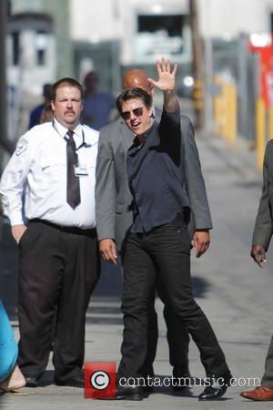Tom Cruise - Tom Cruise waves to fans and signs autographs as he leaves the Jimmy Kimmel Live! show -...