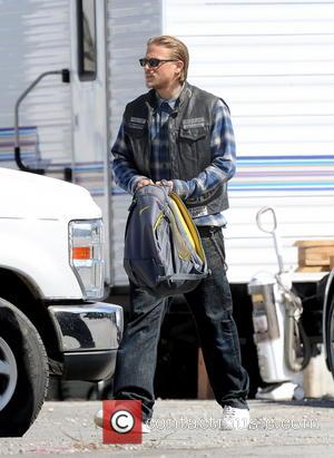 Charlie Hunnam - Charlie Hunnam signed autographs for awaiting fans as he rides off home on his Harley Davidson motorcycle...